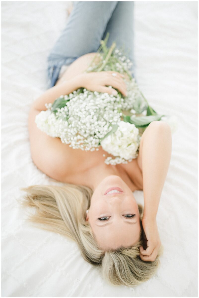 fine art feminine maternity session with florals 