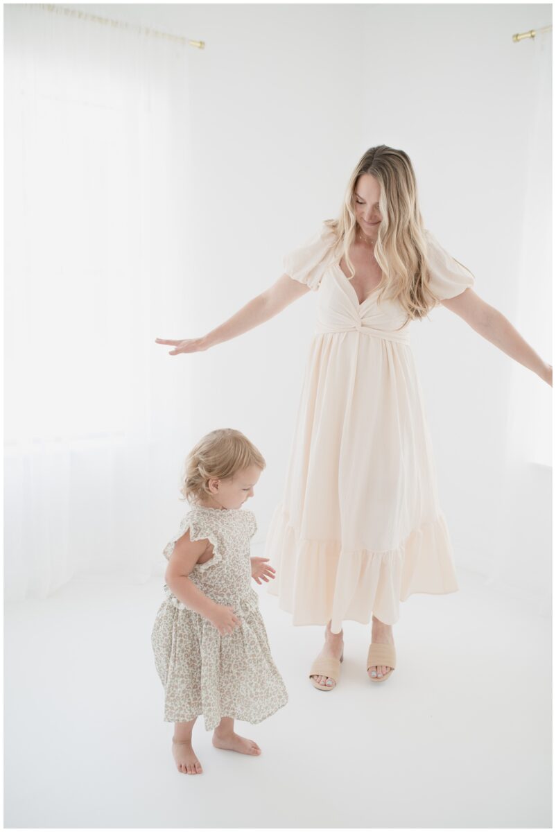 mom and daughter dancing in studio session