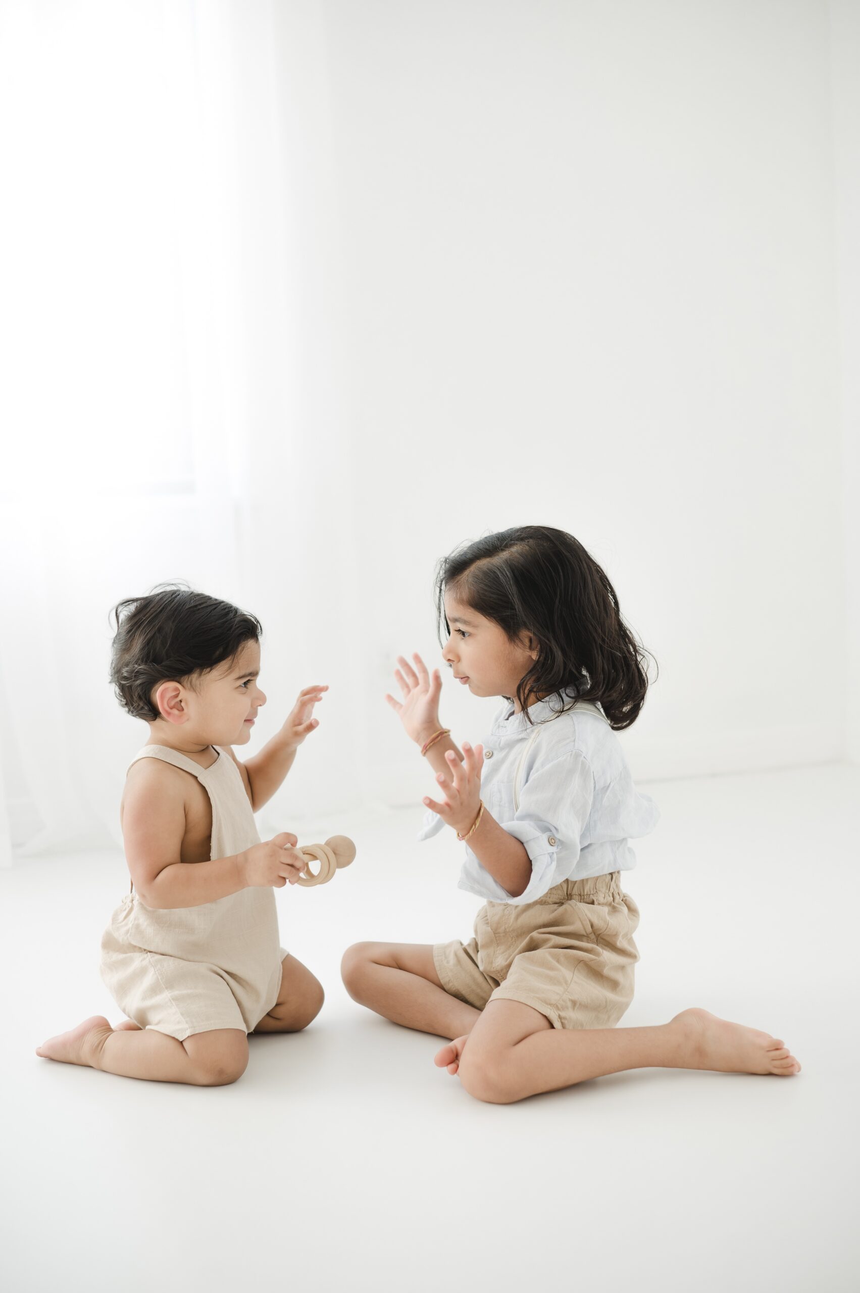 Happy toddler brothers play on the floor of a studio after visiting family friendly breweries in austin